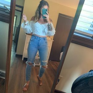 Super cute, cold shoulder boutique top! White with eyelit holes, button up front